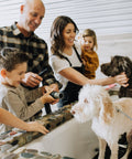 Family bathing their dogs at a Dirty Dogs self-wash station
